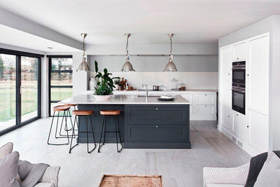 A grey and white modern kitchen, showcasing the Henley Neptune collection, sold by hunters furniture