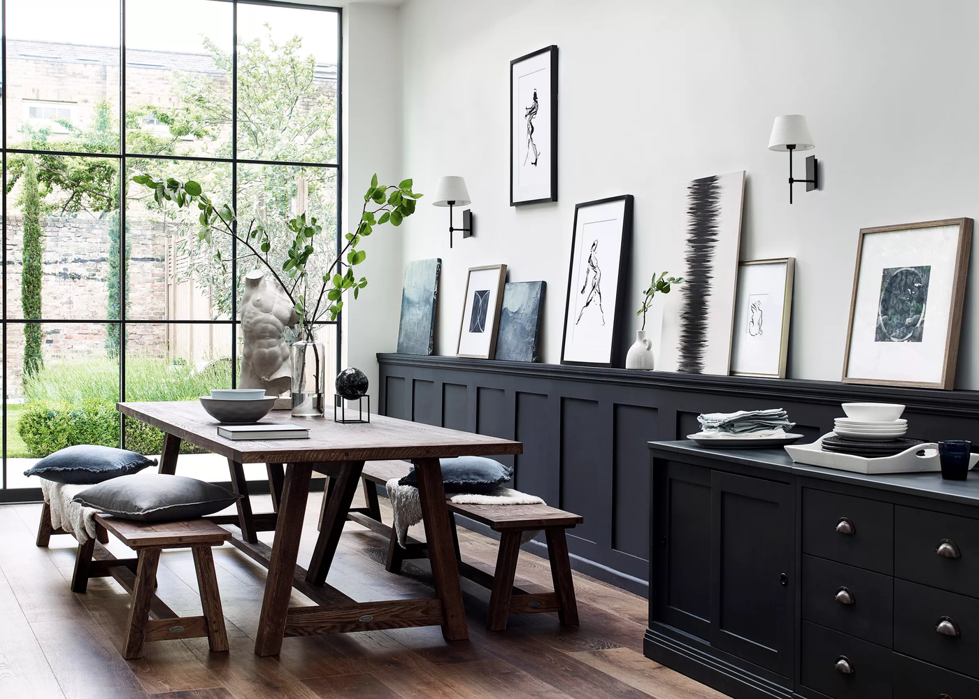 Neptune arundel table and benches in a dark contemporary dining space